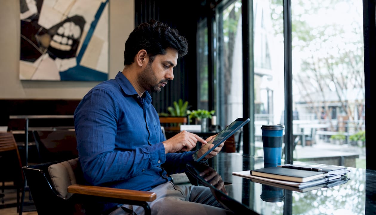 Person reviewing fleet management software on tablet