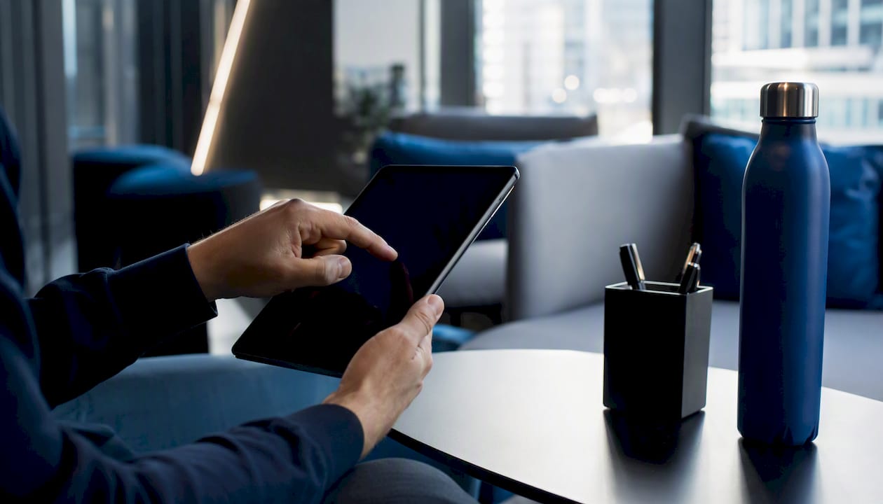 Hands operating AI tool in tech workspace