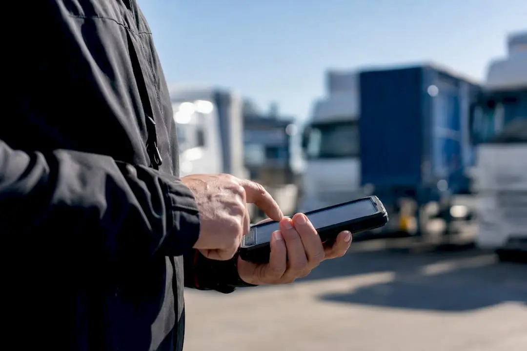 Delivery driver interacting with handheld route device