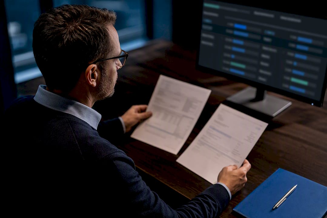 Analyst reviewing purchase order match